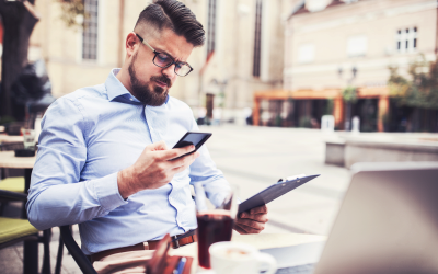 Person Looking at Two Mobile Devices